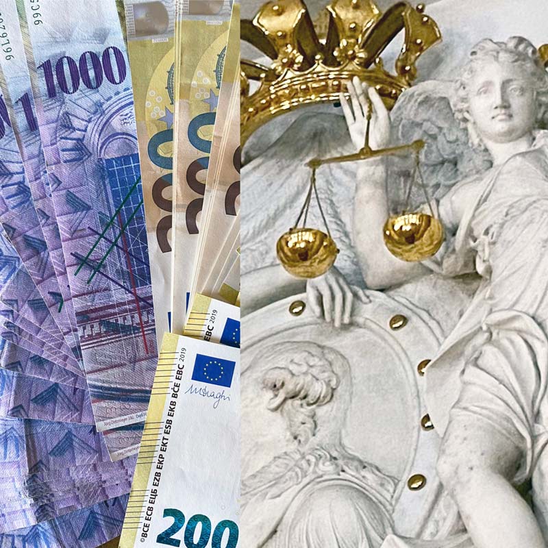 Eurogeldscheine neben Statue